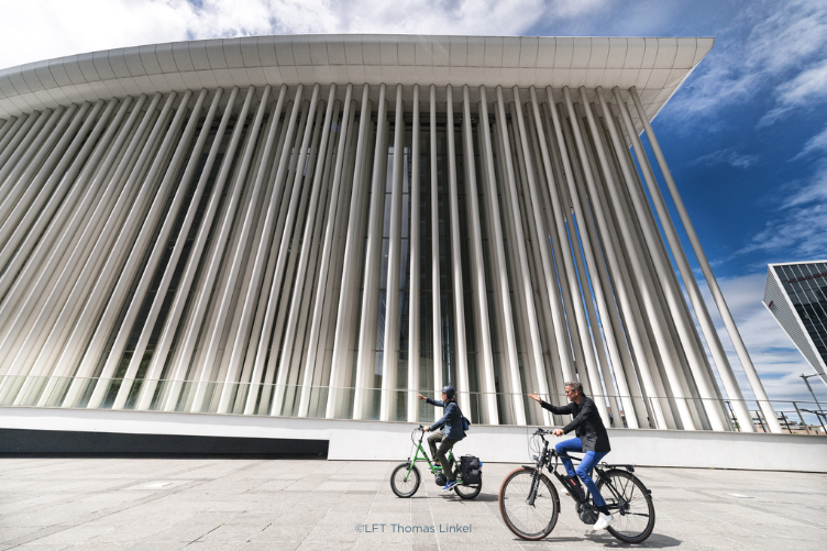 Two bikers in front of the philarmony in Luxembourg