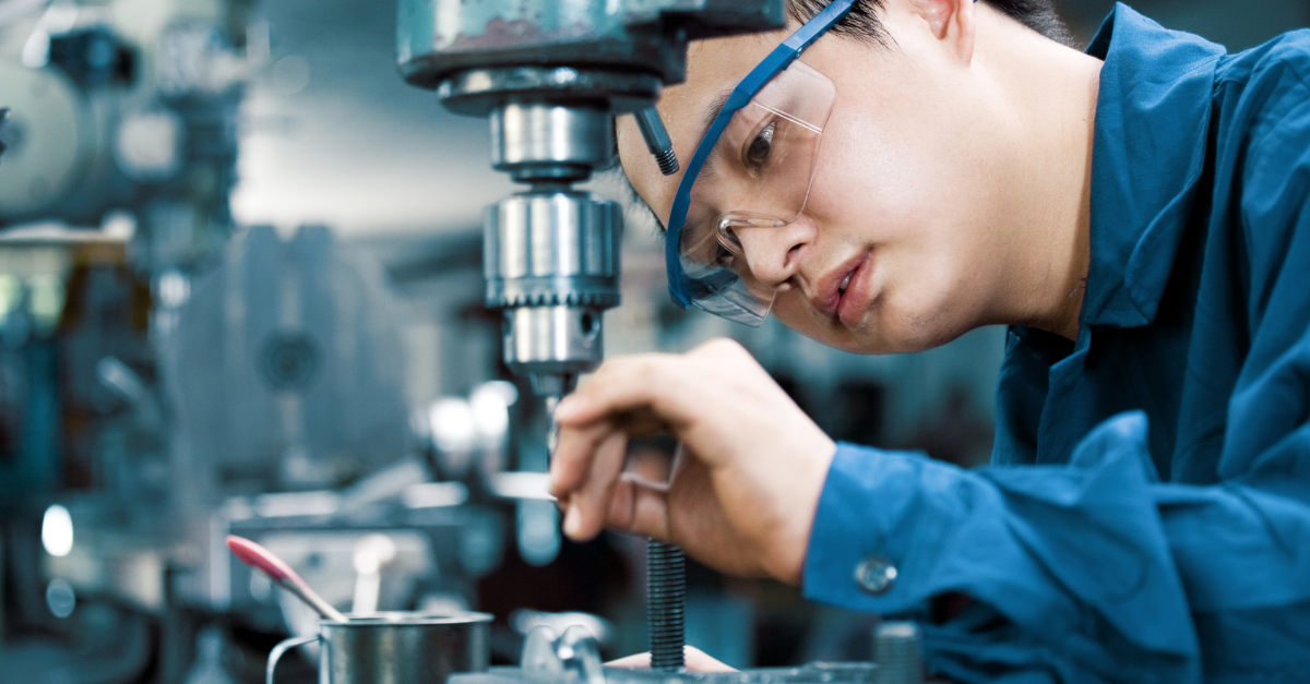 R&D engineer working with a microscope